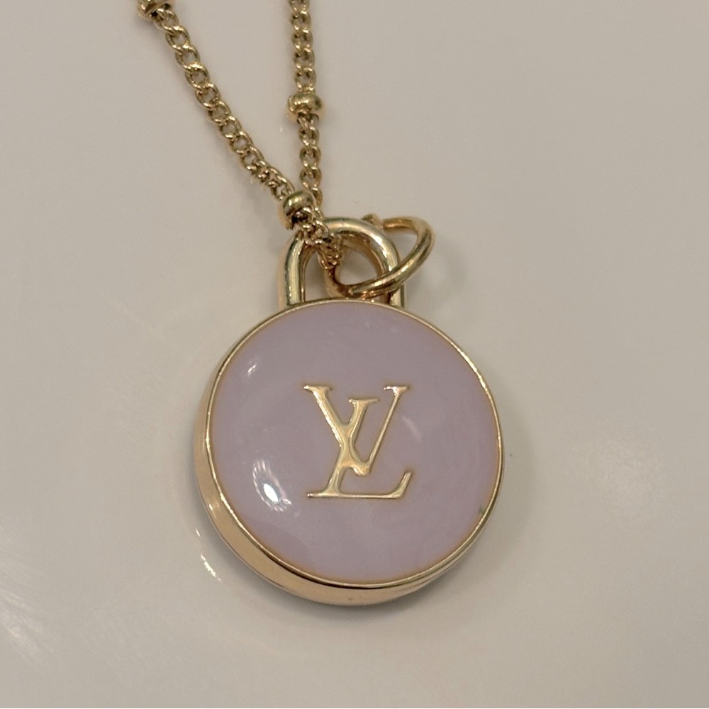 Louis Vuitton Pendant charm with unbranded gold tone chain